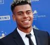 Conscient de sa valeur, le jeune attaquant a déjà déposé plusieurs marques à son nom pour protéger son image.

Désiré Doué (PSG) - Photocall de la 34ème édition des Trophées UNFP du Football au Palais Brongniart à Paris le 11 mai 2026. © Michael Baucher/PsnewZ/Bestimage