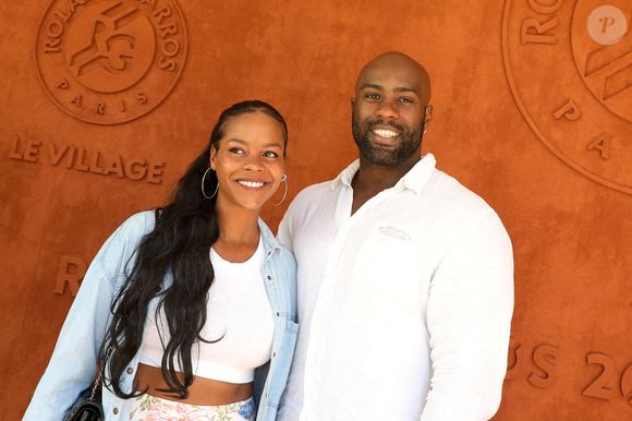 Teddy Riner et sa femme Luthna Plocus au village lors des internationaux de France Roland Garros à Paris le 13 juin 2021.

Photo par Dominique Jacovides / Bestimage