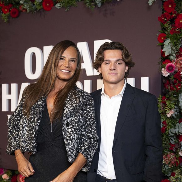 Nathalie Marquay-Pernaut et son fils Tom au photocall de la soirée Omar Harfouch "Dîner chez Maxim's" à Paris le 9 octobre 2024.

© Perusseau / Tribeca / Bestimage