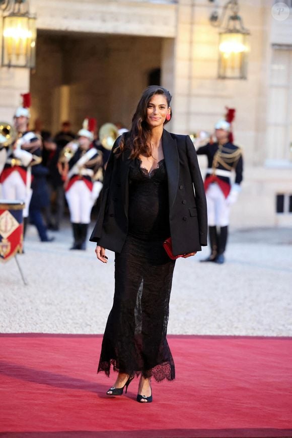 Tatiana Silva (enceinte, ancienne miss Belgique) arrivant au dîner d'état au palais de l'Elysée à Paris en l'honneur de la visite du roi et de la reine de Belgique en France le 14 octobre 2024.

© Dominique Jacovides / Bestimage