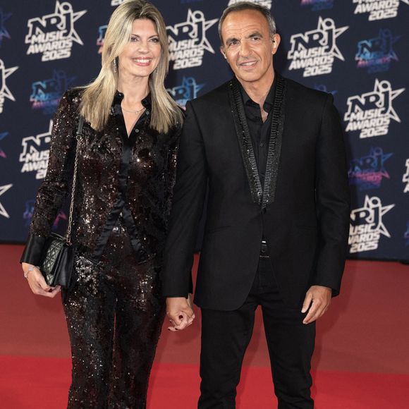 Nikos Aliagas et sa femme Tina Grigoriou assistent à la 27ème édition des NRJ Music Awards le 31 octobre 2025 à Cannes, France. Photo by David NIVIERE/ABACAPRESS.COM
