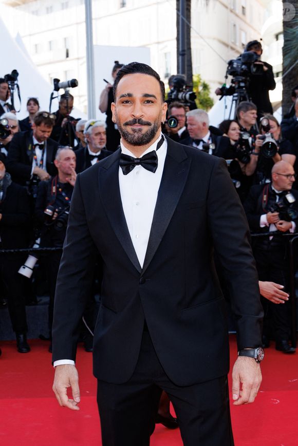 Adil Rami - Montée des marches du film " La vénus électrique " pour la cérémonie d'ouverture du 79ème Festival International du Film de Cannes, le 12 mai 2026. © Jacovides-Moreau /Bestimage