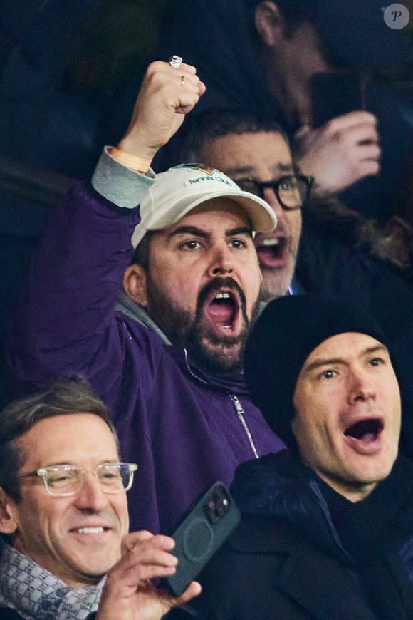 Artus - Célébrités assistent au match de Ligue des champions entre le PSG et Manchester City (4-2) au Parc des Princes à Paris le 22 janvier 2025. © Cyril Moreau/Bestimage