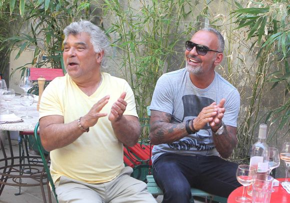 Nicolas Reyes, Christian Audigier - Exclusif - Christian Audigier et sa compagne Nathalie Sorensen en vacances au "Bistrot de Marie" lors d'un concert privé des Gipsy Kings et du chanteur Nicolas Reyes a St Remy de Provence le 17 juin 2013. © TM / BESTIMAGE