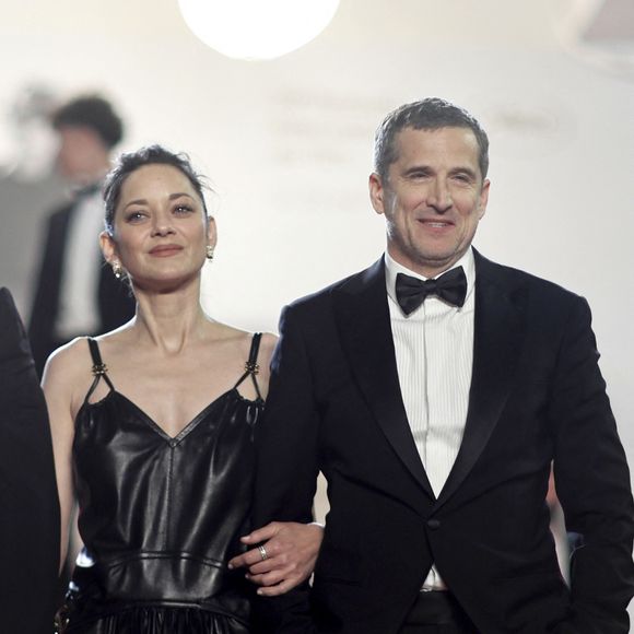 Marion Cotillard et Guillaume Canet - Descente des marches du film " Karma " lors du 79ème Festival International du Film de Cannes, le 15 mai 2026. © Jacovides-Moreau / Bestimage