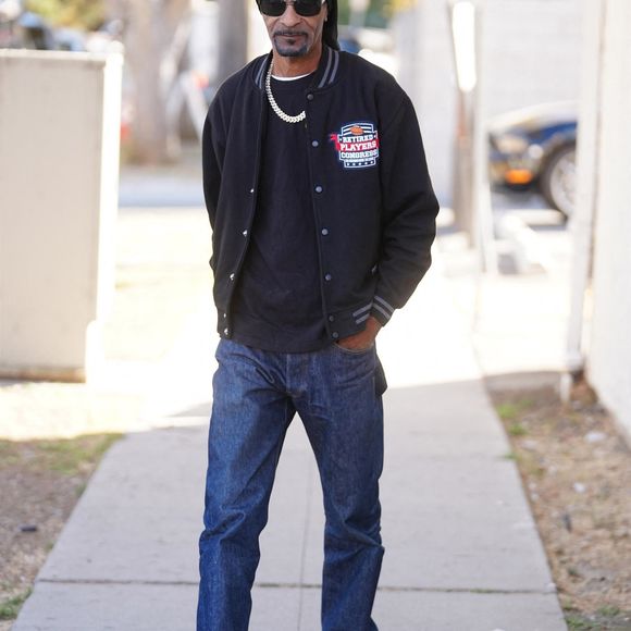 Studio City, CA  - Snoop Dogg and Claudia Wells makes an appearance at the Armani Wells shop 34th Anniversary Celebrity Arrivals in Studio City.



Pictured: Snoop Dogg, Claudia Wells