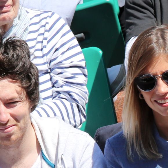Alexandra Rosenfeld et son compagnon Jean Imbert assistent au quart de finale entre Jo-Wilfried Tsonga et Roger Federer lors des Internationaux de France de tennis a Roland-Garros le 4 juin 2013. 
Jacovides / Agence / Bestimage