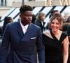En parallèle de sa vie familiale, l'épouse du footballeur mène une brillante carrière d'entrepreneuse.

Brice Samba (Stade Rennais) - 34e édition des Trophées UNFP du Football au Palais Brongniart à Paris, le 11 mai 2026. © Pool - UNFP / FEP /ICON/PsnewZ/Bestimage