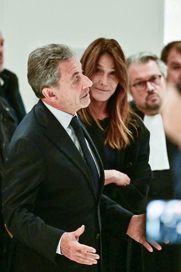 Nicolas Sarkozy et sa femme Carla Bruni - Nicolas Sarkozy condamné à 5 ans de prison à l'issue du procès de l'affaire du financement libyen au tribunal correctionnel de Paris, le 25 septembre 2025. L'ancien chef de l'Etat était accompagné de sa femme, C.Bruni. Nicolas Sarkozy, jugé coupable d’association de malfaiteurs, sera prochainement convoqué en vue de lui signifier la date de son incarcération. 
© Christian Liewig / Bestimage
