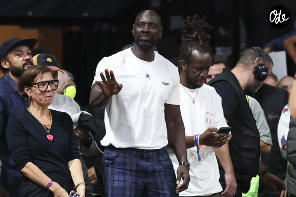 Omar Sy, Youssoupha Mabiki et Fabrice Eboué au match de basket : Paris affronte Monaco (94-99) en Ligue Betclic Elite à l'Adidas Arena à Paris le 12 octobre 2025

© Michtof / PsnewZ / Bestimage