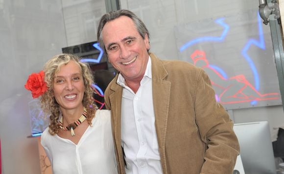 Valeria Attinelli, Philippe Lavil -  Vernissage de l'exposition " Allumeuse" de Valeria Attinelli a la galerie Caplain a Paris le 18 juin 2013.