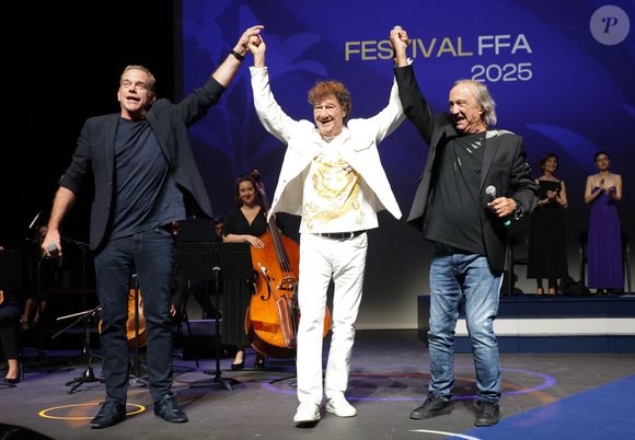 Claude Dubois, Robert Charlebois et Garou - Cérémonie de remise des prix lors de la 18ème édition du Festival du Film Francophone d'Angoulême (FFA) le 30 août 2025 à Angoulême.
© Guirec Coadic / Bestimage