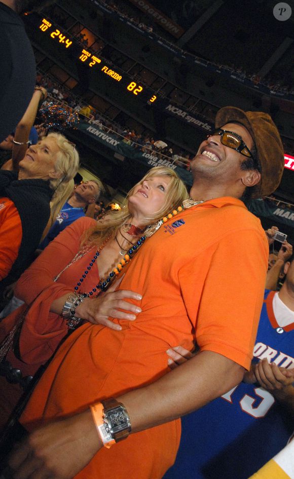 Yannick Noah et sa femme Isabelle Camus lors du match de championnat de basket-ball masculin de la NCAA Division 1 à Atlanta, GA, USA le 2 avril 2007. Photo by Christophe Guibbaud/Cameleon/ABACAPRESS.COM