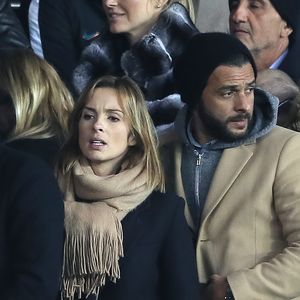 Maxim Nucci et sa compagne Isabelle Ithurburu enceinte assistent au huitième de finale retour de Ligue des Champion, du Paris Saint-Germain contre le Real Madrid au Parc des Princes à Paris le 6 mars 2018. © Cyril Moreau/Bestimage