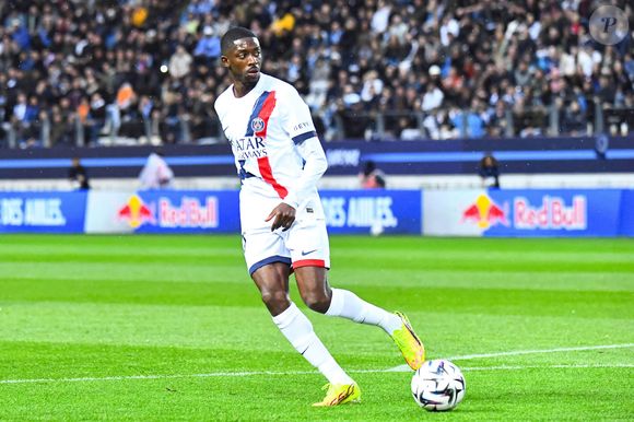 Cette griffe prestigieuse, créée en 1975, propose des essences sur-mesure exclusivement vendues dans ses propres boutiques à travers le monde.

Ousmane Dembele (Paris SG) - Match de Ligue 1 McDonald's "Paris FC - Paris Saint-Germain (PSG) (2-1)" au stade Jean Bouin, le 17 mai 2026.
Baptiste Autissier / PsnewZ / Bestimage
