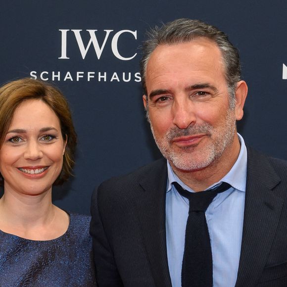 L'acteur Jean Dujardin et la danseuse sur glace Nathalie Pechalat arrivent au tapis rouge des Laureus World Sport Awards Paris 2023 à la Cour Vendôme le 08 mai 2023 à Paris, France. Photo by ABACAPRESS.COM