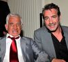 Exclusif -  Jean-Paul Belmondo, à gauche, et Jean Dujardin participent à la soirée de Gala caritative au profit de l'association "Des Cantines Scolaires pour les Enfants du Sahel" à Cannes au Five Seas Hotel, le 31 mai 2014. 
JUNIOR / BESTIMAGE