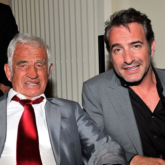 Exclusif -  Jean-Paul Belmondo, à gauche, et Jean Dujardin participent à la soirée de Gala caritative au profit de l'association "Des Cantines Scolaires pour les Enfants du Sahel" à Cannes au Five Seas Hotel, le 31 mai 2014. 
JUNIOR / BESTIMAGE