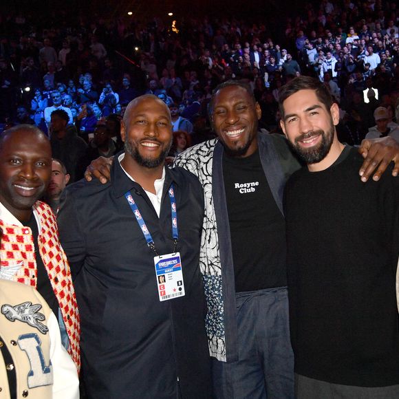 Omar Sy et sa femme Hélène, Boris Diaw, Ian Mahinmi, Nikola Karabatic, Robert Pires - Célébrités assistent au match 1 du NBA Paris Games 2025 à L'Accor Arena Bercy à Paris le 23 janvier 2025. © Veeren/Bestimage