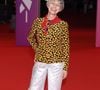 Lio a quant à elle opté pour la couleur avec une veste noire à imprimé floral jaune, ornée de boutons dorés, signée Yves Saint Laurent, avec son pantalon argenté et un foulard rouge assortis aux motifs de son haut. 

Lio, présidente du jury de la révélation - Arrivées à la cérémonie de clôture de la 52ème édition du Festival du Cinéma Américain de Deauville le 12 septembre 2026. © Denis Guignebourg / Bestimage