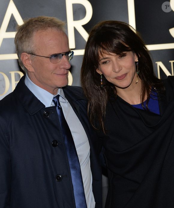 Sophie Marceau et son compagnon Christophe Lambert - Arrivee des people au defile Giorgio Armani Haute Couture Printemps/Ete 2014 au Palais de Tokyo a Paris, le 21 janvier 2014.