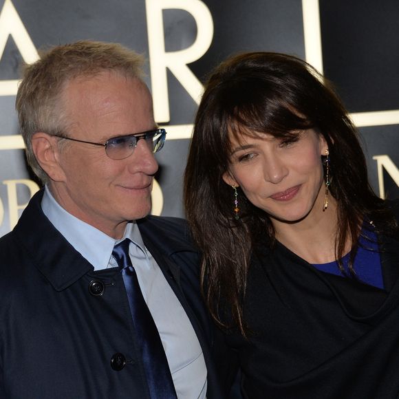 Sophie Marceau et son compagnon Christophe Lambert - Arrivee des people au defile Giorgio Armani Haute Couture Printemps/Ete 2014 au Palais de Tokyo a Paris, le 21 janvier 2014.