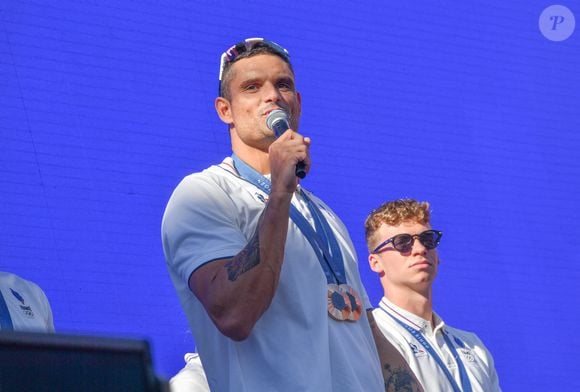 Florent Manaudou _Léon Marchand - L'équipe de France de natation acclamée au club France lors des Jeux Olympiques de Paris2024 (JO) le 5 aout 2024.