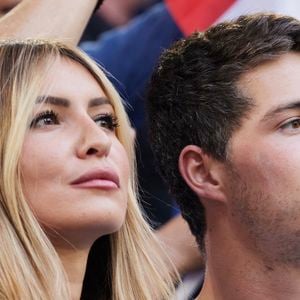 Dylan Deschamps et sa compagne Mathilde Cappelaere - Célébrités dans les tribunes du match du groupe D de l'Euro 2024 entre l'équipe de France face à l'Autriche (1-0) à Dusseldorf en Allemagne le 17 juin 2024. © Cyril Moreau/Bestimage
