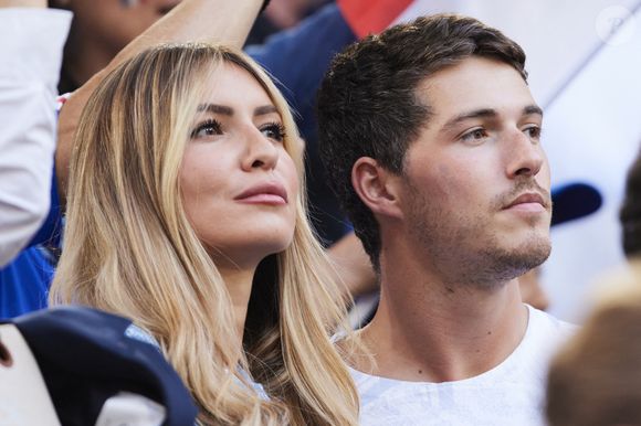 Dylan Deschamps et sa compagne Mathilde Cappelaere - Célébrités dans les tribunes du match du groupe D de l'Euro 2024 entre l'équipe de France face à l'Autriche (1-0) à Dusseldorf en Allemagne le 17 juin 2024. © Cyril Moreau/Bestimage
