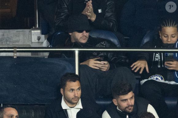 Dj Snake - Célébrités dans les tribunes du match de 8ème de finale aller de la Ligue Des Champions 2025-2026 (LDC) "PSG - Chelsea (5-2)" au Parc des Princes à Paris le 11 mars 2026. © Cyril Moreau/Bestimage
