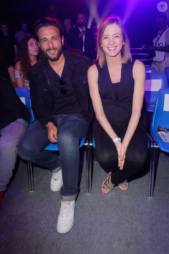 Maxim Nucci (Yodelice)  et sa compagne enceinte Isabelle Ithurburu - Maxim Nucci (Yodelice)  et sa compagne enceinte Isabelle Ithurburu assistent au match de boxe de Tony Yoka au palais des sports de Paris, le 23 juin 2018 © Veeren-CVS/Bestimage