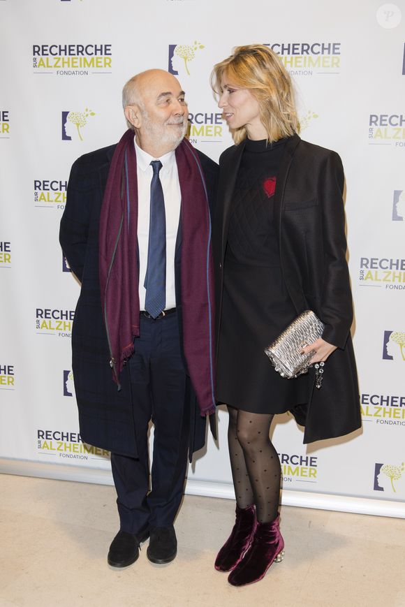 "Quand il ne travaille pas, il est chiant !", lui aurait-elle déclaré

Gérard Jugnot et sa femme Patricia Campi - People au concert du 13ème Gala 2018 de l'Association pour la Recherche sur Alzheimer à la salle Pleyel à Paris le 12 février 2018.  © Coadic Guirec-Pierre Perusseau/Bestimage
