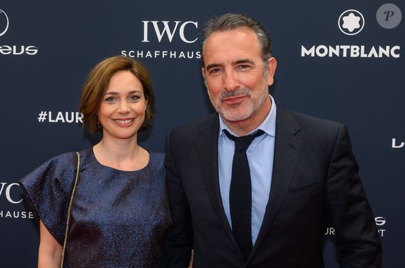 L'acteur Jean Dujardin et la danseuse sur glace Nathalie Pechalat arrivent au tapis rouge des Laureus World Sport Awards Paris à la Cour Vendôme à Paris, France. Photo by ABACAPRESS.COM