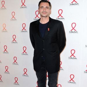 Olivier Minne posant lors d'un photocall pour le lancement du Sidaction 2014 et du 'Sidaction 20e anniversaire' qui s'est tenu au Musée du quai Branly à Paris, France, le 10 mars 2014. Photo par Aurore Marechal/Abaca