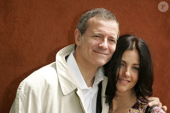 L'acteur français Francis Huster et sa femme Cristiana Reali posent au 'Village' lors de la 7ème journée des Internationaux de France de Tennis qui se déroulent au stade Roland Garros à Paris, France, le 3 juin 2006. Photo Gouhier-Nebinger-Zabulon/ABACAPRESS.COM.
