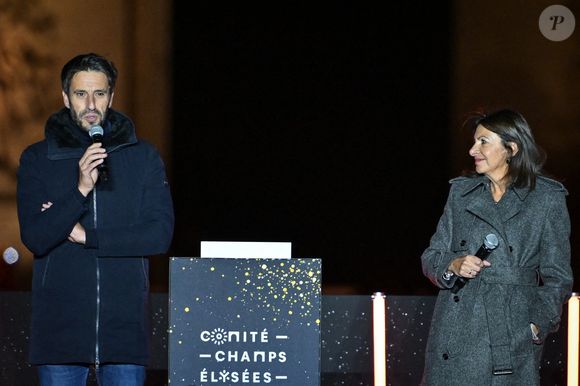 Le président de Paris 2024, Tony Estanguet, prononce un discours aux côtés de la maire de Paris Anne Hidalgo lors de l'inauguration des illuminations de Noël des Champs Elysées à Paris, le 24 novembre 2024. Photo par Firas Abdullah/ABACAPRESS.COM