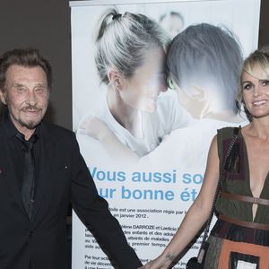 Exclusif - Johnny Hallyday et sa femme Laeticia Hallyday - Soirée au profit de l'Association "La Bonne étoile" de Laeticia Hallyday lors du 3ème Longines Paris Eiffel Jumping à la plaine de Jeux de Bagatelle à Paris le 1er juillet 2016 dans le Pavillon Eiffel du Longines Paris Eiffel Jumping décoré par Luxury Living.
© Olivier Borde / Veeren / Bestimage