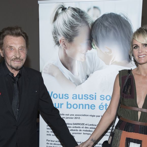 Exclusif - Johnny Hallyday et sa femme Laeticia Hallyday - Soirée au profit de l'Association "La Bonne étoile" de Laeticia Hallyday lors du 3ème Longines Paris Eiffel Jumping à la plaine de Jeux de Bagatelle à Paris le 1er juillet 2016 dans le Pavillon Eiffel du Longines Paris Eiffel Jumping décoré par Luxury Living.
© Olivier Borde / Veeren / Bestimage