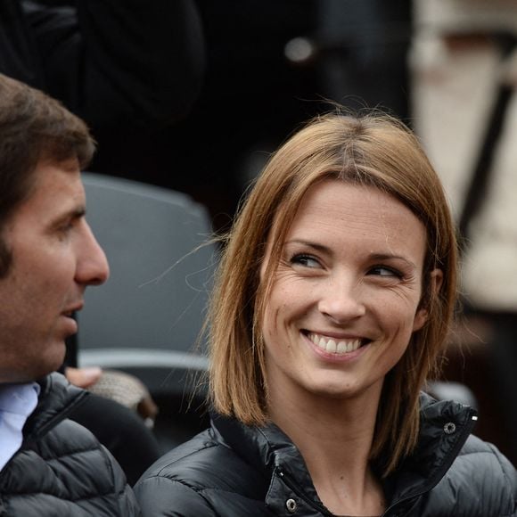Isabelle Ithurburu et Gonzalo Quesada regardent un match lors du deuxième tour des Internationaux de France de tennis à Roland Garros à Paris, France, le 28 mai 2014. Photo Laurent Zabulon/Abaca