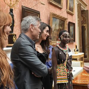 George Clooney et Amal Clooney lors de la réception en l'honneur des lauréats des King's Trust Awards au palais de Buckingham le 25 juin 2025  Stefan Rousseau/WPA-Pool/Bestimage