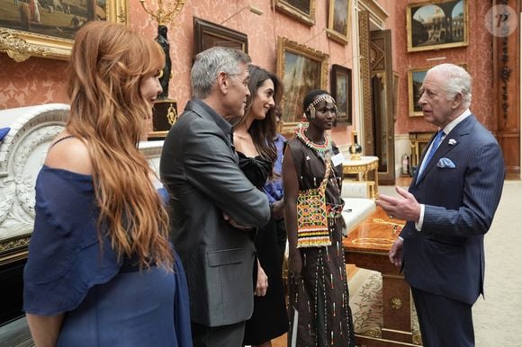 George Clooney et Amal Clooney lors de la réception en l'honneur des lauréats des King's Trust Awards au palais de Buckingham le 25 juin 2025  Stefan Rousseau/WPA-Pool/Bestimage