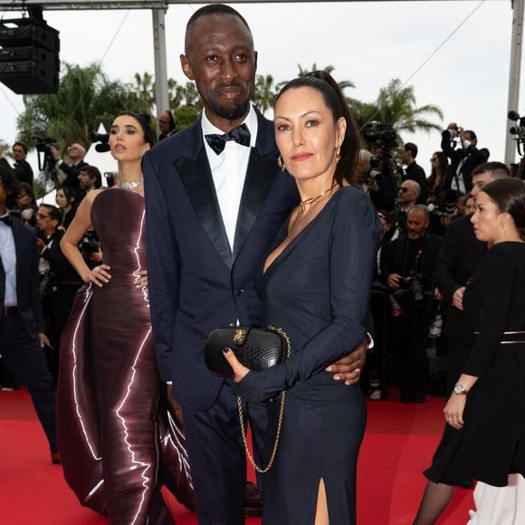 Thomas Ngijol et sa femme Karole Rocher - Montée des marches du film « Highest 2 Lowest  » lors du 78ème Festival International du Film de Cannes, au Palais des Festivals à Cannes. Le 19 mai 2025
© Olivier Borde/ Bestimage