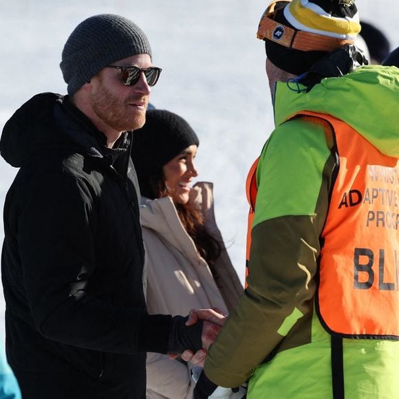 Le prince Harry, duc de Sussex et Meghan Markle, duchesse de Sussex, en visite au camp d'entrainement des athlètes des Invictus Games 2024 à Whistler en Colombie Britannique, le 14 février 2024. (Backgrid USA / Bestimage).