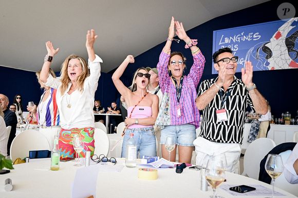 Une bien heureuse nouvelle pour la famille Coupérie-Eiffel

Exclusif - La famille Coupérie-Eiffel (Virginie Coupérie-Eiffel, Coco Couperie-Eiffel, Philippine Coupérie-Eiffel et Marie Coupérie-Eiffel) soutient son cheval Fan de Bacon lors du Grand Prix de la Société d'Exploitation de la Tour Eiffel dans l'espace VIP au Longines Paris Eiffel Jumping au pied de la Tour Eiffel sur le Champ-de-Mars à Paris, France, le 22 juin 2025. © Perusseau-Veeren/Bestimage