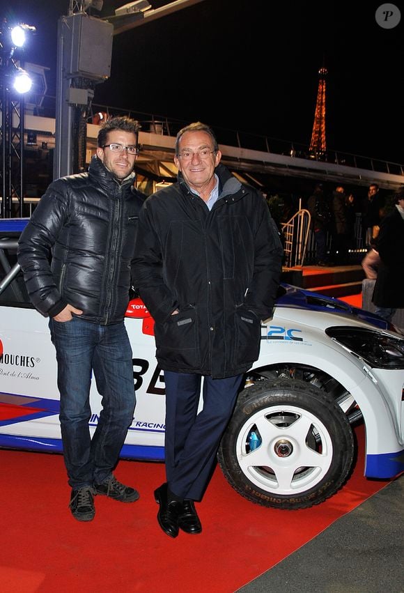 Jean-Pierre Pernaut et son fils Olivier posent devant leur Citroen C4 lors de la conference de presse de la 25eme edition du Trophee Andros a Paris le 27 novembre 2013.