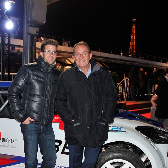 Jean-Pierre Pernaut et son fils Olivier posent devant leur Citroen C4 lors de la conference de presse de la 25eme edition du Trophee Andros a Paris le 27 novembre 2013.