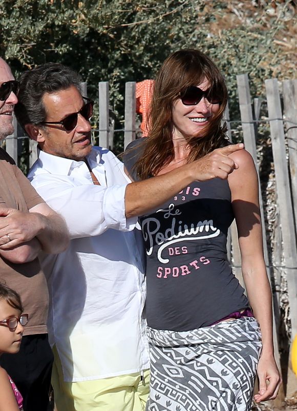 Exclusif - Nicolas Sarkozy, sa femme Carla Bruni-Sarkozy et leur fille Giulia sont sur la plage de Cavalières au pied du Cap Nègre, le 14 juillet 2014, pendant leurs vacances.  © FITOUSSI-JACOVIDES-MOREAU/BESTIMAGE