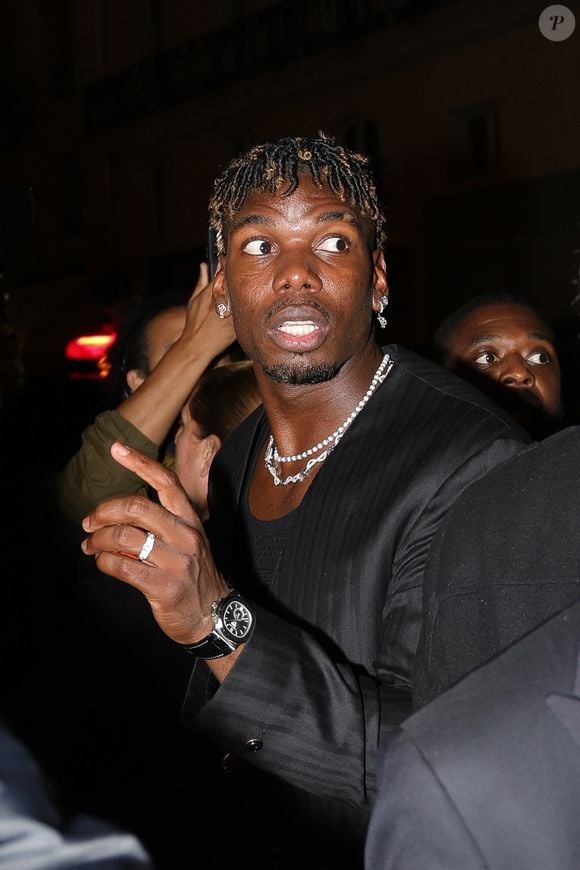 Paris, FRANCE  - Paul Pogba and wife Zulay Pogba turn heads at the Paris premiere of 4-0, showcasing their fashionable looks on the red carpet.



Pictured: Paul Pogba