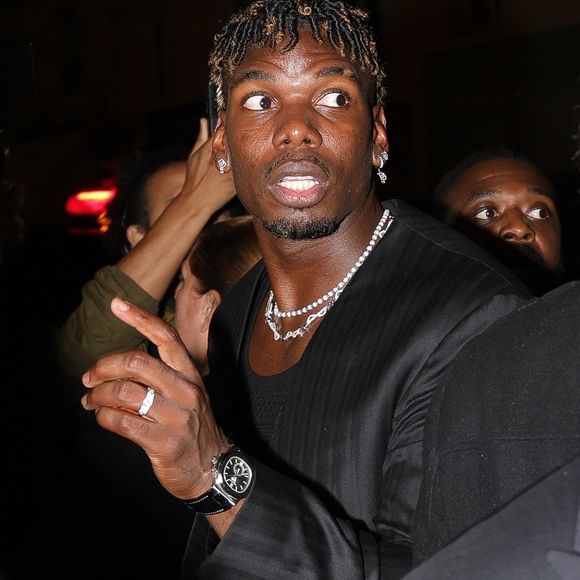 Paris, FRANCE  - Paul Pogba and wife Zulay Pogba turn heads at the Paris premiere of 4-0, showcasing their fashionable looks on the red carpet.



Pictured: Paul Pogba