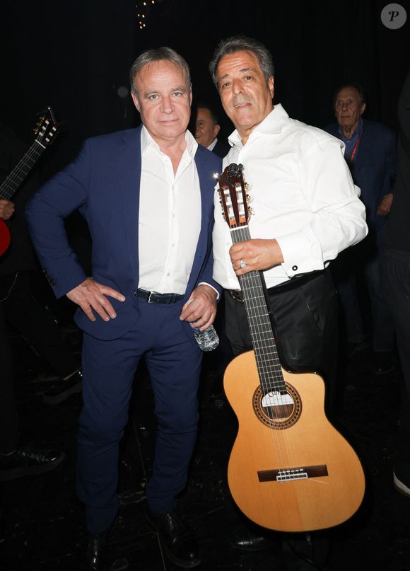 Fabien Lecœuvre et Chico Bouchikhi lors du concert de Chico & The Gypsies, au Palais des Congrès, le 24 mai 2025. 

Photo par © Guirec Coadic / Bestimage